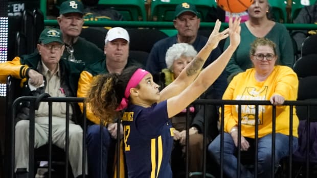 Feb 12, 2022; Waco, Texas, USA; West Virginia Mountaineers forward Esmery Martinez (12) shoots against the Baylor Lady Bears during the second half at Ferrell Center. Mandatory Credit: Chris Jones-USA TODAY Sports