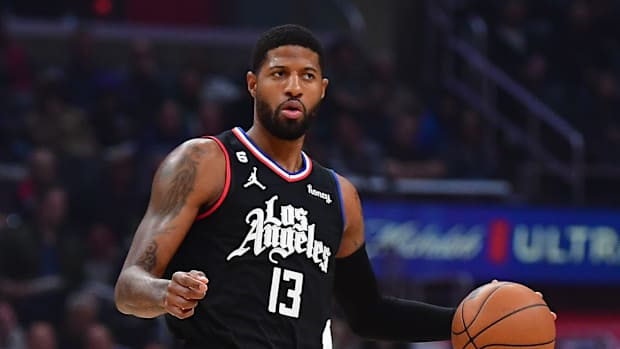 Clippers guard Paul George dribbles the ball.