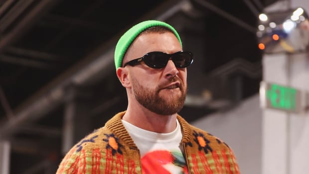 Kansas City Chiefs tight end Travis Kelce enters Empower Field at Mile High Stadium before a game.