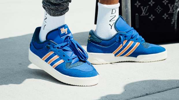 View of Derrick Rose's blue and orange adidas shoes.