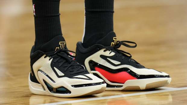 View of Jayson Tatum's white, black, and red Jordan sneakers.