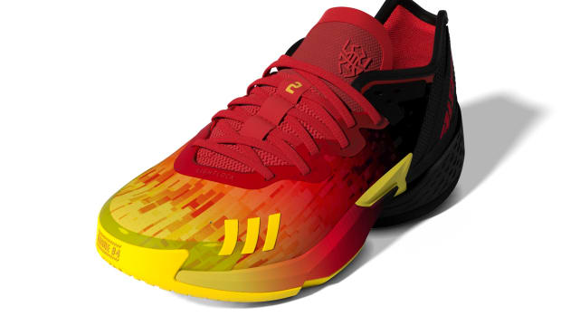 Red, black, and yellow Donovan Mitchell shoes.