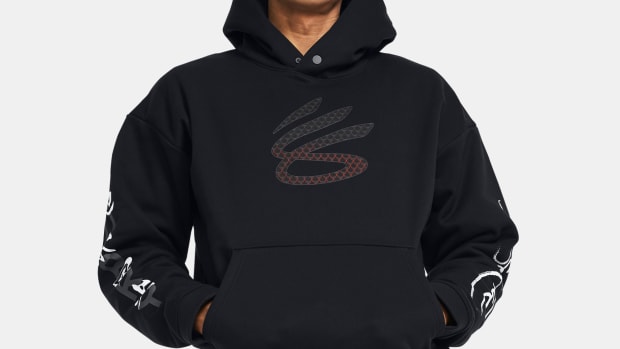 A model wears a black and red Curry Brand hoodie.