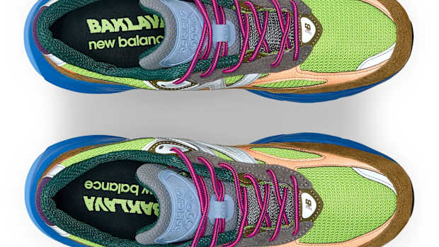 View of brown, blue, and green New Balance shoes.