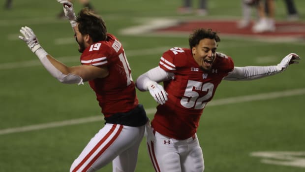 Nick Herbig and Kaden Johnson celebrate a home win.