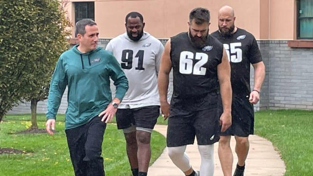 Howie Roseman with Fletcher Cox (91), Jason Kelce (62), and Lane Johnson following a walkthrough practice on Oct. 26, 2022