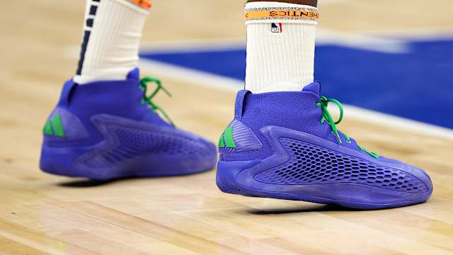 Minnesota Timberwolves guard Anthony Edwards' blue and green adidas sneakers.