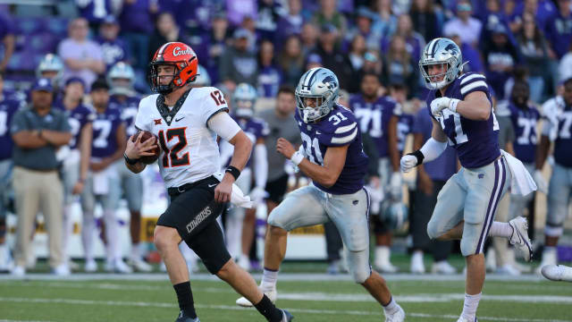 Oct 29, 2022; Manhattan, Kansas, USA; Oklahoma State Cowboys quarterback Gunnar Gundy (12) scrambles against the Kansas State Wildcats during the fourth quarter at Bill Snyder Family Football Stadium. Mandatory Credit: Scott Sewell-USA TODAY Sports