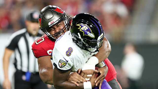 Tampa Bay Buccaneers defensive tackle Vita Vea sacks Baltimore Ravens quarterback Lamar Jackson.