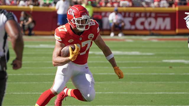 Kansas City Chiefs tight end Travis Kelce runs with the football.