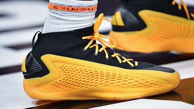 Minnesota Timberwolves guard Anthony Edwards' gold and black adidas sneakers.