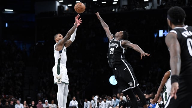 Milwaukee Bucks guard Damian Lillard (0) shoots the ball against Brooklyn Nets forward Dorian Finney-Smith (28)