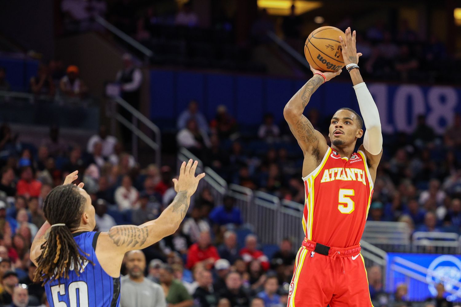 Hawks guard Dejounte Murray shoots over Magic guard Cole Anthony.