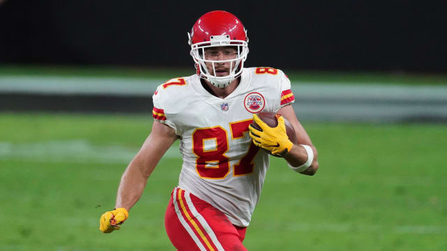 Kansas City Chiefs tight end Travis Kelce carries the ball against the Las Vegas Raiders.