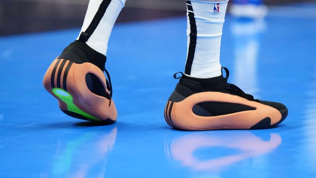 Los Angeles Clippers guard James Harden's orange and black adidas sneakers.