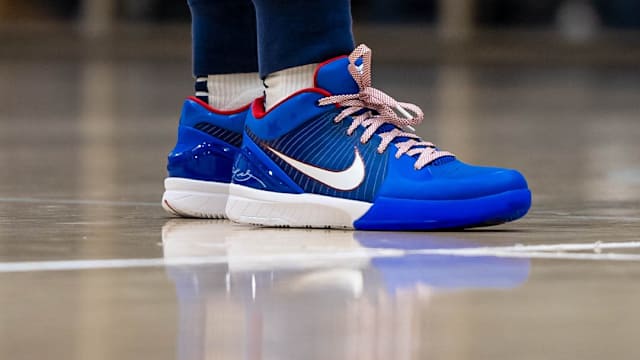 Duke coach Kara Lawson's blue and white Nike Kobe sneakers.