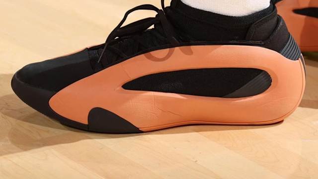 Los Angeles Clippers guard James Harden's black and orange adidas sneakers.