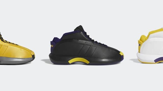 Side view of Kobe Bryant's gold, black, and white adidas sneakers.