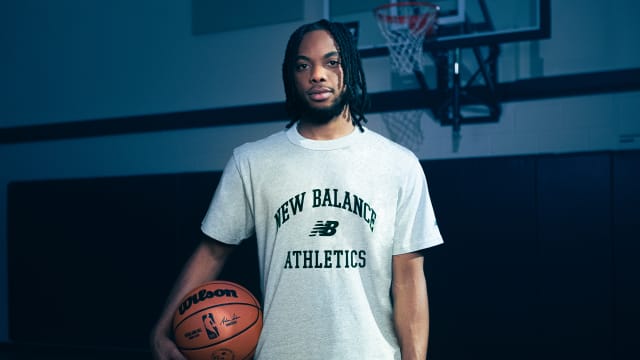 Darius Garland poses for a picture in a New Balance shirt.