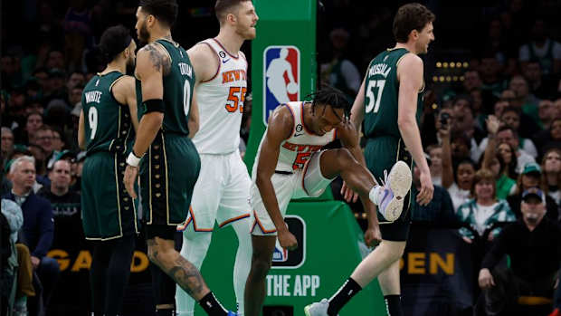 Quickley (2nd from right) celebrates during his 38-point showcase from last season in Boston