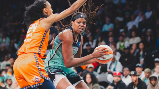 Jonquel Jones (R) earned yet another double-double in Sunday afternoon's Finals berth-clinching victory.