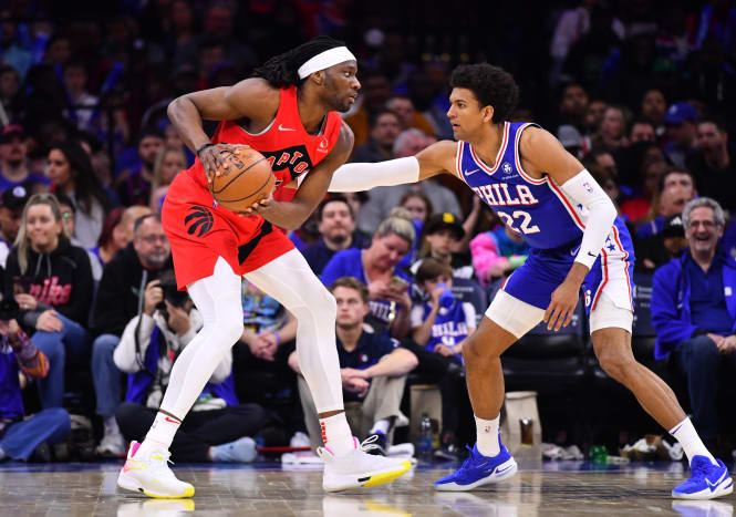 Toronto Raptors forward Precious Achiuwa (5) controls the ball against Philadelphia 76ers guard Matisse Thybulle (22) in the fourth quarter at Wells Fargo Center