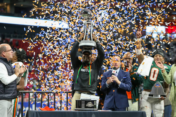 Dec 16, 2023; Atlanta, GA, USA; Florida A&amp;M Rattlers head coach Willie Simmons holds up the Celebration Bowl trophy after a victory against the Howard Bison at Mercedes-Benz Stadium.