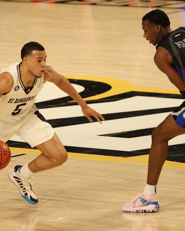 Mar 6, 2021; Richmond, Virginia, USA; St. Bonaventure Bonnies guard Jaren Holmes (5) drives to the basket as Saint Louis Billikens guard Javonte Perkins (3) defends in the second half in a semifinal of the Atlantic 10 conference tournament at Stuart C. Siegel Center. Mandatory Credit: Geoff Burke-USA TODAY Sports