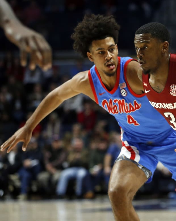 Arkansas Razorbacks forward Trey Wade (3) drives to the basket as Mississippi Rebels forward Jaemyn Brakefield (4) defends during the first half at The Sandy and John Black Pavilion at Ole Miss.