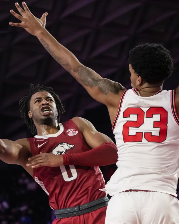 Arkansas Razorbacks guard Stanley Umude (0) shoots over Georgia Bulldogs guard Braelen Bridges (23) during the first half at Stegeman Coliseum. Umude finished with 31 points in the win.