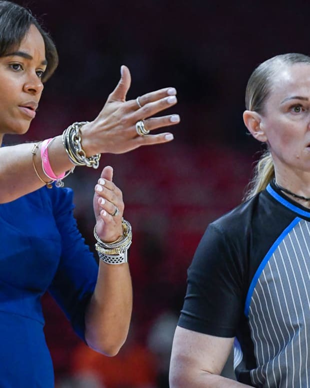 Texas A&M coach Joni Taylor on the court against the Arkansas Razorbacks on Sunday.