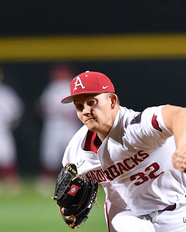Razorbacks' pitcher Zack Morris warms up before coming into game against Alabama Crimson Tide on Friday night.