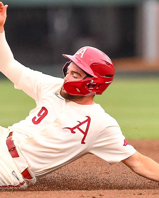 Razorbacks' John Bolton slides into second base during win over Texas A&M on Saturday