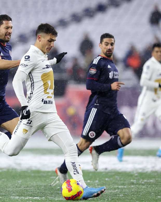 Mar 9, 2022; Foxborough, Massachusetts, USA; Pumas UNAM forward Juan Ignacio Dinenno (9) shoots the ball defended by New England Revolution defender Omar Gonzalez (3) during the first half at Gillette Stadium. Mandatory Credit: Paul Rutherford-USA TODAY Sports