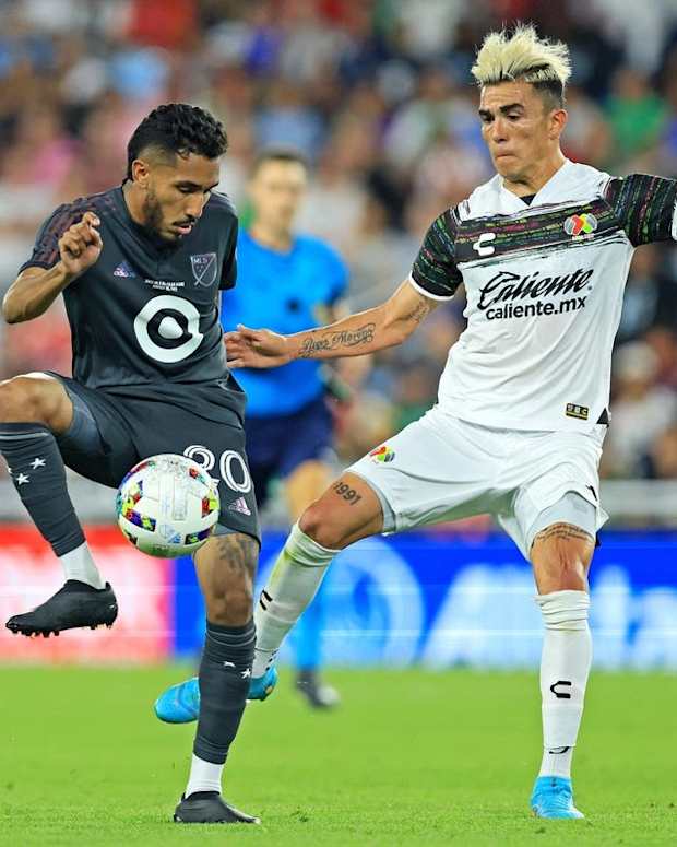 Aug 10, 2022; Saint Paul, MN, USA; MLS forward Jesus Ferreira (20) of FC Dallas moves the ball against Liga MX defender Luis Reyes (14) of Atlas during the MLS All-Star Game at Allianz Field. Mandatory Credit: Aaron Doster-USA TODAY Sports