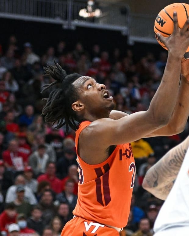 Mar 18, 2022; Milwaukee, WI, USA; Virginia Tech Hokies forward Justyn Mutts (25) shoots against the Texas Longhorns during the first half in the first round of the 2022 NCAA Tournament at Fiserv Forum. Mandatory Credit: Benny Sieu-USA TODAY Sports