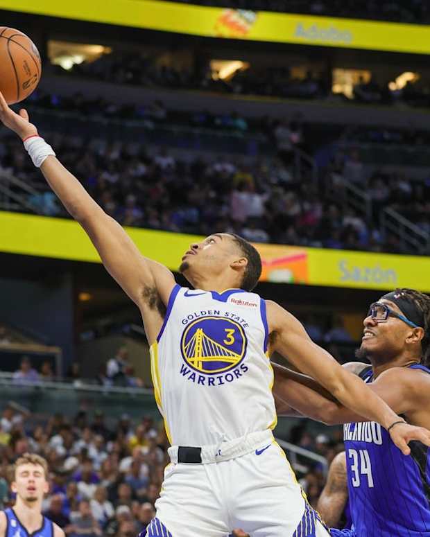 Nov 3, 2022; Orlando, Florida, USA; Golden State Warriors guard Jordan Poole (3) goes to the basket in front of Orlando Magic center Wendell Carter Jr. (34) during the second quarter at Amway Center. Mandatory Credit: Mike Watters-USA TODAY Sports