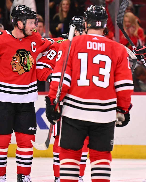 Nov 1, 2022; Chicago, Illinois, USA; Chicago Blackhawks forward Jonathan Toews (19) celebrates with forward Patrick Kane (88), forward Max Domi (13) and defenseman Caleb Jones (82) after scoring a power play goal in the third period against the New York Islanders at the United Center. New York defeated Chicago 3-1. Mandatory Credit: Jamie Sabau-USA TODAY Sports
