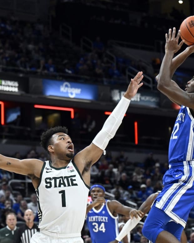 Nov 15, 2022; Indianapolis, Indiana, USA; Kentucky Wildcats guard Cason Wallace (22) shoots the ball over Michigan State Spartans guard Pierre Brooks (1) during the first half at Gainbridge Fieldhouse. Mandatory Credit: Marc Lebryk-USA TODAY Sports