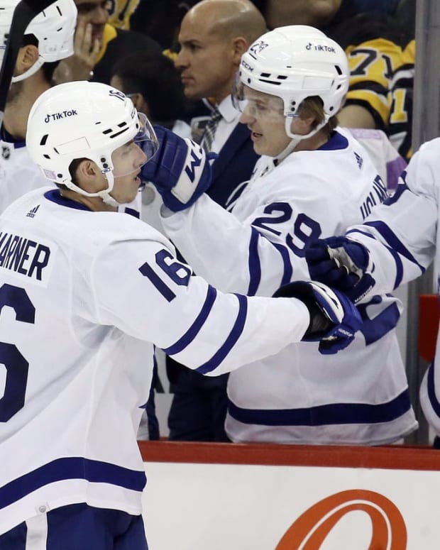 Nov 15, 2022; Pittsburgh, Pennsylvania, USA; Toronto Maple Leafs right wing Mitchell Marner (16) celebrates his goal with the Toronto bench against the Pittsburgh Penguins during the first period at PPG Paints Arena. Mandatory Credit: Charles LeClaire-USA TODAY Sports