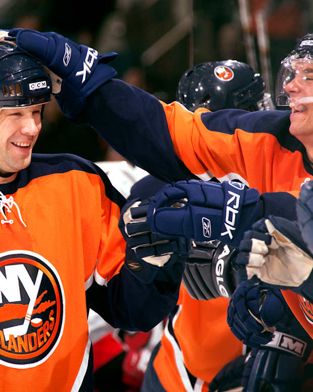 New York Islanders left wing Chris Simon (12) celebrates with teammates against the Carolina Hurricanes at Nassau Veterans Memorial Coliseum in Uniondale, N.Y., on Oct. 21, 2006.