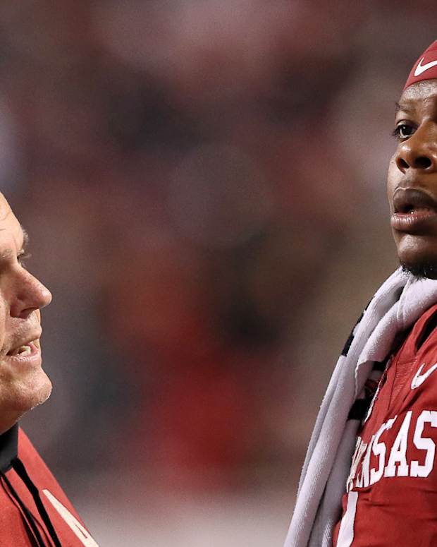 Razorbacks coach Sam Pittman talking to quarterback KJ Jefferson