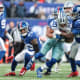 Dec 19, 2021; East Rutherford, New Jersey, USA; Dallas Cowboys running back Tony Pollard (20) is tackled by New York Giants inside linebacker Tae Crowder (48) during the second half at MetLife Stadium.