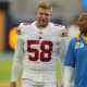 Dec 12, 2021; Inglewood, California, USA; New York Giants long snapper Casey Kreiter (58) talks with Los Angeles Chargers cornerback Chris Harris (25) during the game at SoFi Stadium.