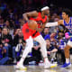 Toronto Raptors forward Precious Achiuwa (5) controls the ball against Philadelphia 76ers guard Matisse Thybulle (22) in the fourth quarter at Wells Fargo Center