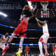 Chicago Bulls forward DeMar DeRozan (11) defends Toronto Raptors forward Chris Boucher (25) during the first quarter at United Center