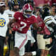 Alabama Crimson Tide wide receiver Ja'Corey Brooks (7) pushes away Vanderbilt Commodores defensive back Jeffrey Ugochukwu (38) during the first half at Bryant-Denny Stadium.