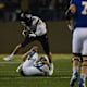 UAlbany's linebacker Dylan Kelly (42) jumps over SDSU player on Friday, Dec. 15, 2023 at Dana J. Dykhouse in Brookings.