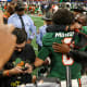 Dec 16, 2023; Atlanta, GA, USA; Florida A&M Rattlers quarterback Jeremy Moussa (8) and head coach Willie Simmons celebrate after a victory against the Howard Bison in the Celebration Bowl at Mercedes-Benz Stadium. 