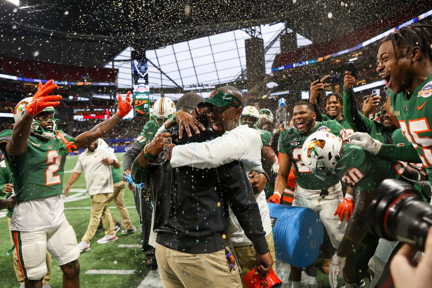 Dec 16, 2023; Atlanta, GA, USA; Florida A&M Rattlers head coach Willie Simmons is doused with a bucket against the Howard Bison in the second half at Mercedes-Benz Stadium.